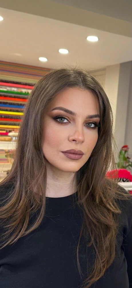 After: the same selfie with a full glam makeup look applied photorealistically by the AI Makeup generator