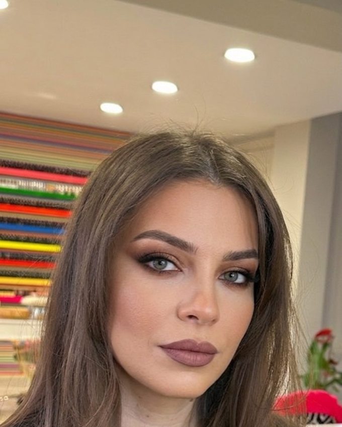 After photo: the same woman's selfie with a glam makeup look applied by the AI Makeup app, identity and skin tone unchanged